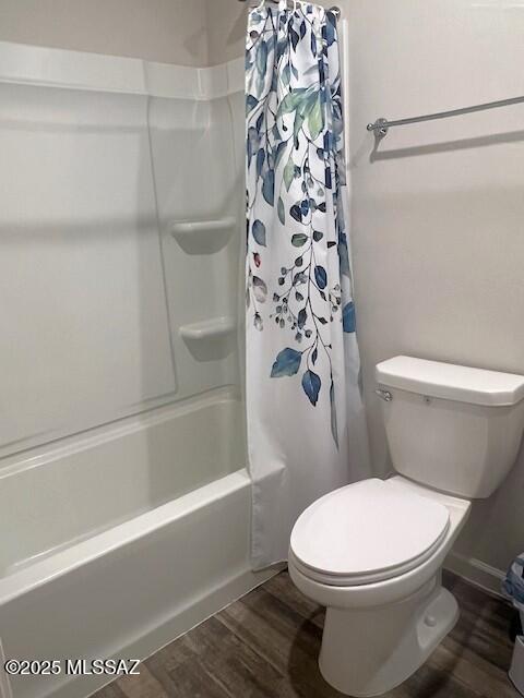365 S Redwood Loop, Benson, AZ 85602 - full bath with wood finished floors, toilet, and shower / bathtub combination with curtain