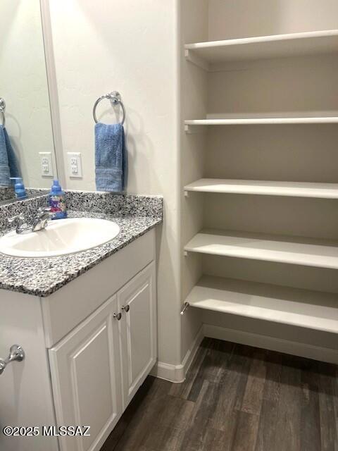 365 S Redwood Loop, Benson, AZ 85602 - bathroom featuring wood finished floors, vanity, and baseboards