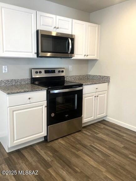 365 S Redwood Loop, Benson, AZ 85602 - kitchen featuring appliances with stainless steel finishes, dark wood-style flooring, white cabinetry, baseboards, and stone countertops