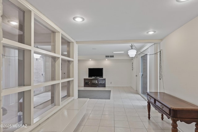 1047 E Hedrick Dr, Tucson, AZ 85719 - unfurnished living room with tile patterned floors and recessed lighting
