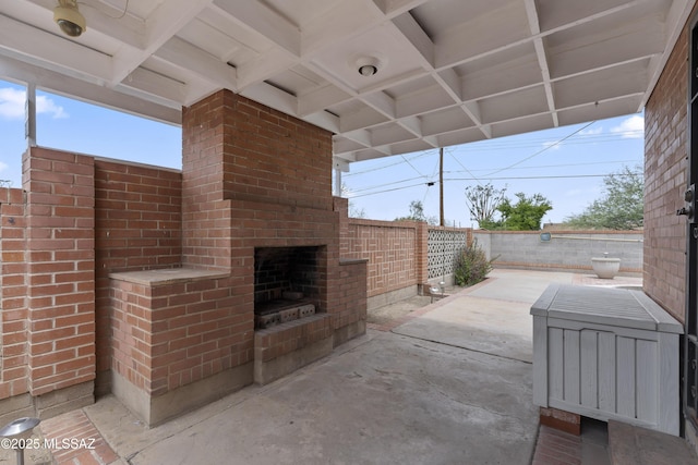 1047 E Hedrick Dr, Tucson, AZ 85719 - fenced backyard featuring an outdoor brick fireplace and a patio
