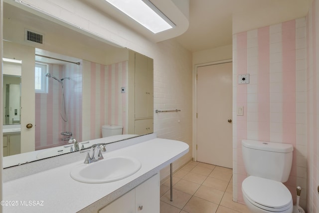 1047 E Hedrick Dr, Tucson, AZ 85719 - bathroom with toilet, vanity, tile patterned floors, and a shower