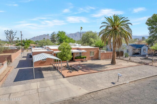 1047 E Hedrick Dr, Tucson, AZ 85719 - view of front of home featuring a mountain view and a carport