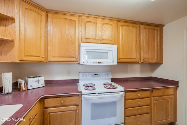 1047 E Hedrick Dr, Tucson, AZ 85719 - kitchen featuring white appliances, dark countertops, and open shelves