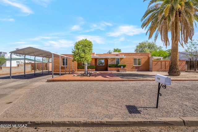 1047 E Hedrick Dr, Tucson, AZ 85719 - ranch-style home featuring a carport, concrete driveway, and brick siding