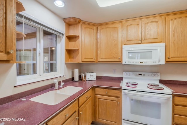 1047 E Hedrick Dr, Tucson, AZ 85719 - kitchen with white appliances, a sink, dark countertops, recessed lighting, and light brown cabinets