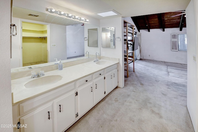 810 E Placita Leslie, Tucson, AZ 85718 - bathroom with wood ceiling, visible vents, a sink, and double vanity