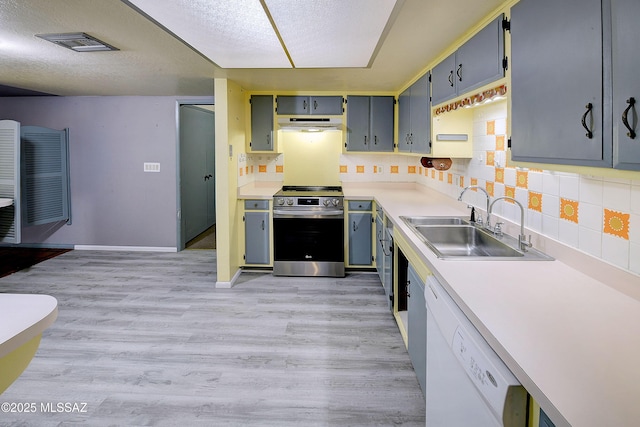 810 E Placita Leslie, Tucson, AZ 85718 - kitchen with a sink, visible vents, dishwasher, under cabinet range hood, and stainless steel range with electric cooktop