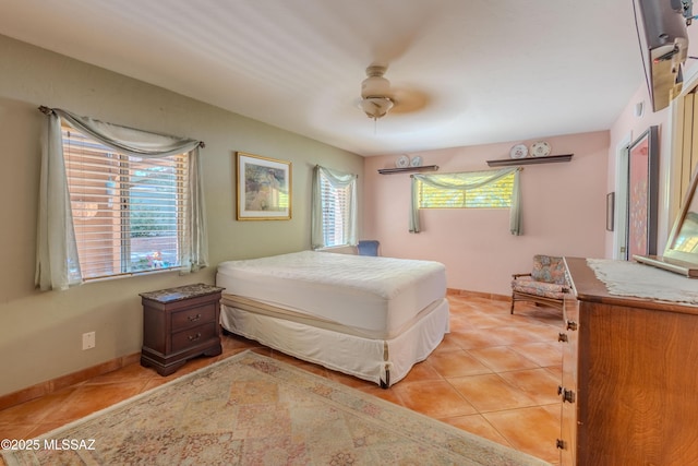 149 E Los Arcos, Green Valley, AZ 85614 - bedroom with light tile patterned floors and ceiling fan