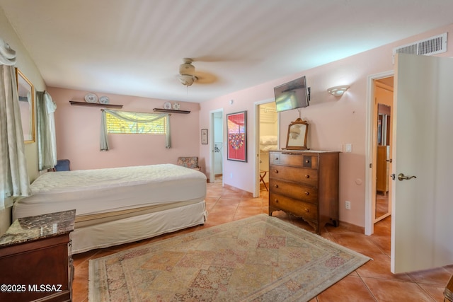 149 E Los Arcos, Green Valley, AZ 85614 - bedroom featuring ceiling fan, visible vents, and light tile patterned flooring