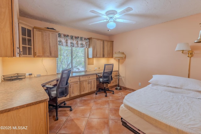 149 E Los Arcos, Green Valley, AZ 85614 - bedroom with built in desk and light tile patterned flooring