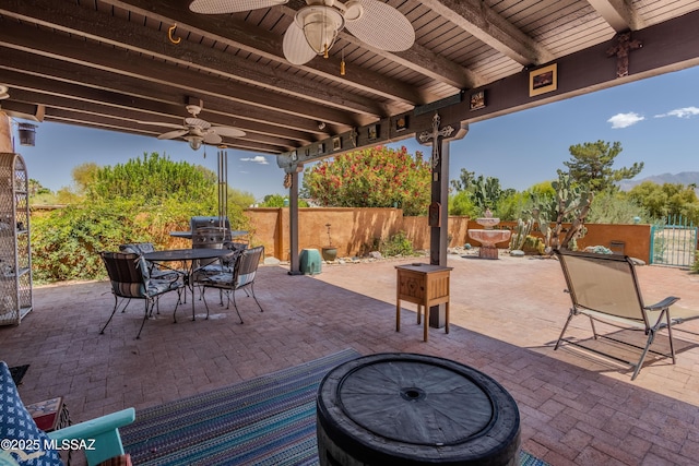 149 E Los Arcos, Green Valley, AZ 85614 - view of patio with a fenced backyard, outdoor dining space, and a ceiling fan