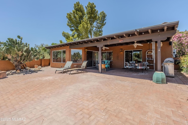 149 E Los Arcos, Green Valley, AZ 85614 - view of patio featuring outdoor dining space, area for grilling, ceiling fan, and fence