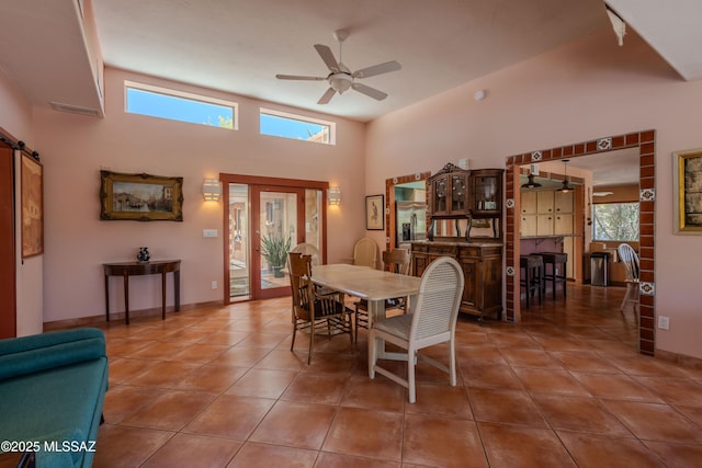 149 E Los Arcos, Green Valley, AZ 85614 - dining space featuring a healthy amount of sunlight, tile patterned flooring, baseboards, and ceiling fan