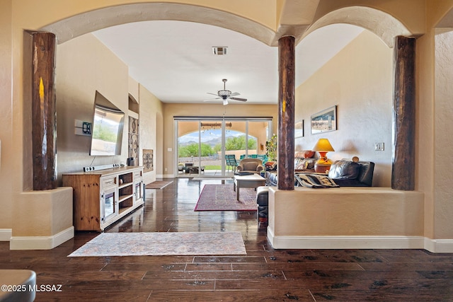 33 Camino Olympia, Rio Rico, AZ 85648 - living area featuring ceiling fan, dark wood-style flooring, baseboards, and a textured wall