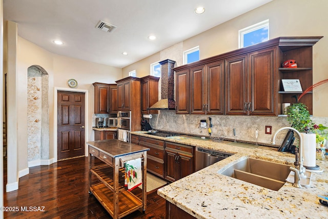 33 Camino Olympia, Rio Rico, AZ 85648 - kitchen featuring a sink, appliances with stainless steel finishes, light stone countertops, tasteful backsplash, and dark wood-style flooring