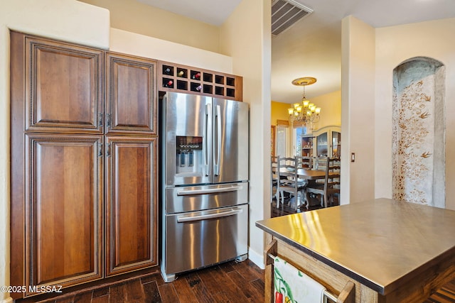 33 Camino Olympia, Rio Rico, AZ 85648 - kitchen with stainless steel fridge, dark wood-style floors, and a chandelier