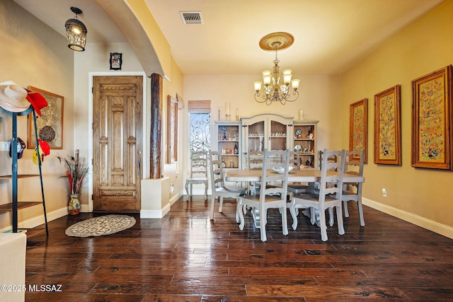 33 Camino Olympia, Rio Rico, AZ 85648 - dining room with a chandelier, hardwood / wood-style flooring, baseboards, and arched walkways