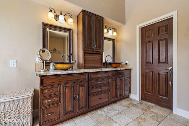 33 Camino Olympia, Rio Rico, AZ 85648 - full bathroom featuring baseboards, double vanity, and tile patterned flooring