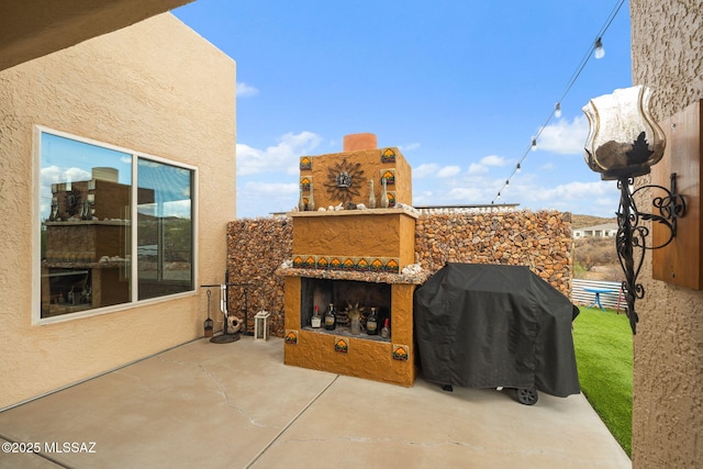 33 Camino Olympia, Rio Rico, AZ 85648 - view of patio with an outdoor fireplace and grilling area