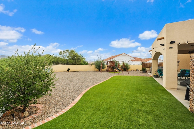 33 Camino Olympia, Rio Rico, AZ 85648 - view of yard with a playground and a patio area