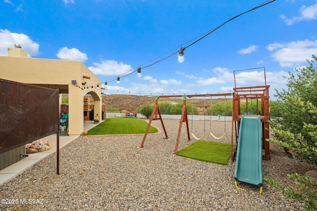 33 Camino Olympia, Rio Rico, AZ 85648 - view of play area with a yard