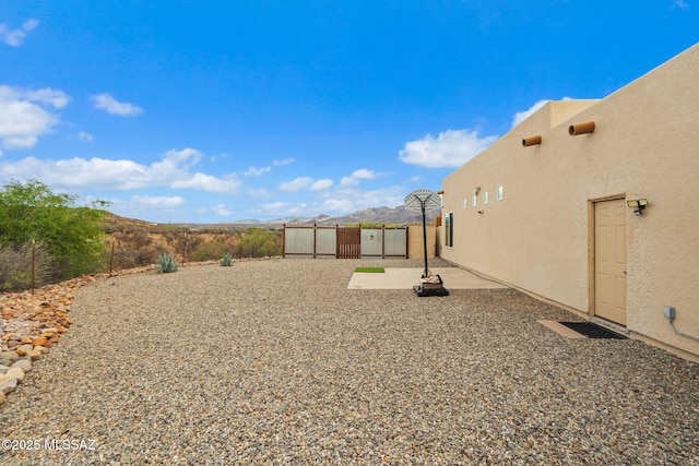 33 Camino Olympia, Rio Rico, AZ 85648 - view of yard featuring a patio area, a mountain view, and fence
