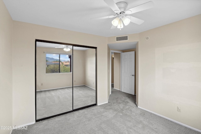 11846 N Copper Butte Dr, Oro Valley, AZ 85737 - unfurnished bedroom featuring carpet flooring, baseboards, a closet, and ceiling fan