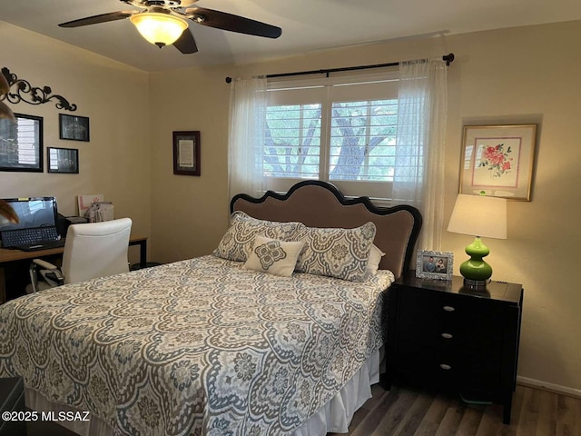 bedroom with wood finished floors, baseboards, and ceiling fan