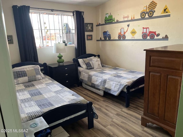 bedroom with wood finished floors