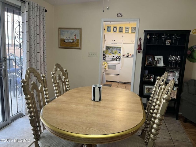 dining space featuring tile patterned floors
