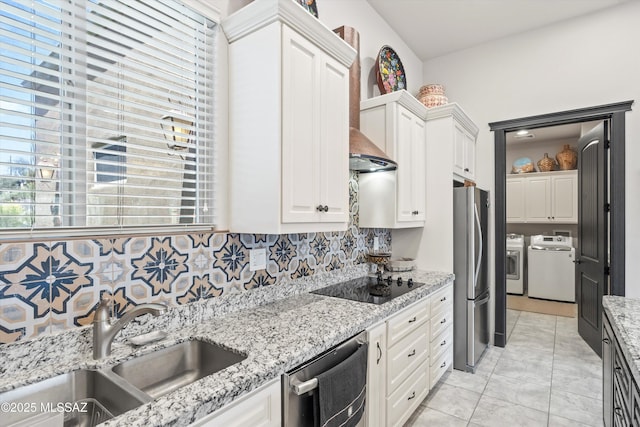 4544 N Camino Real, Tucson, AZ 85718 - kitchen with a sink, stainless steel appliances, tasteful backsplash, independent washer and dryer, and white cabinets