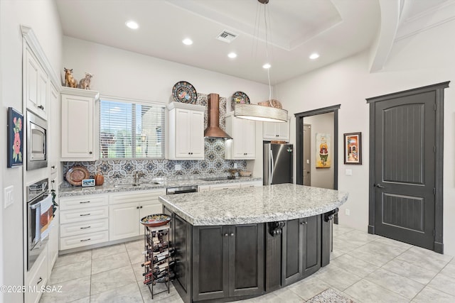 4544 N Camino Real, Tucson, AZ 85718 - kitchen with a sink, stainless steel appliances, backsplash, and white cabinets