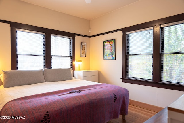 bedroom featuring wood finished floors