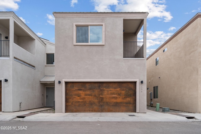 156 E Stone Ct, Tucson, AZ 85705 - view of front of home featuring stucco siding and a garage