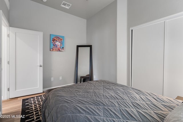 156 E Stone Ct, Tucson, AZ 85705 - bedroom featuring wood finished floors and baseboards