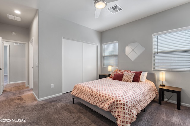 156 E Stone Ct, Tucson, AZ 85705 - carpeted bedroom with a closet, baseboards, and ceiling fan