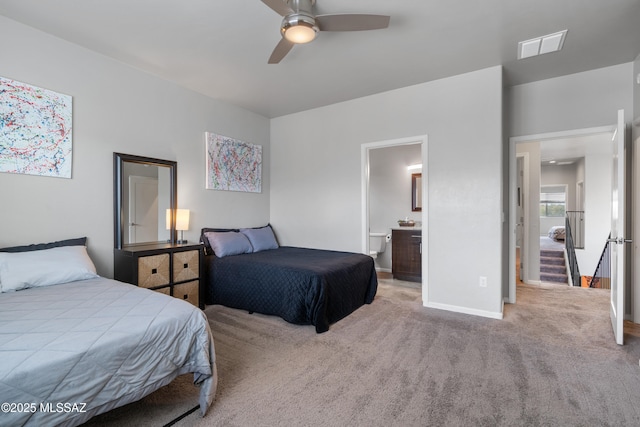 156 E Stone Ct, Tucson, AZ 85705 - bedroom with carpet floors, baseboards, ensuite bath, and ceiling fan