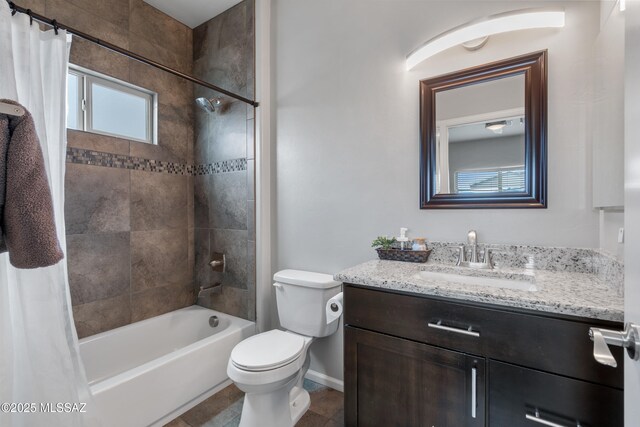 156 E Stone Ct, Tucson, AZ 85705 - bathroom featuring toilet, vanity, shower / bath combo with shower curtain, and baseboards