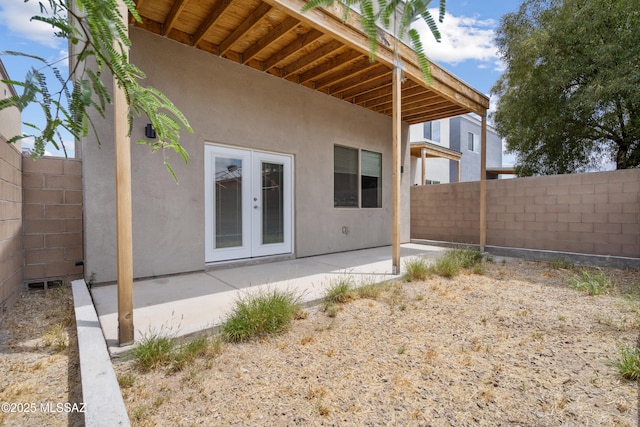 156 E Stone Ct, Tucson, AZ 85705 - rear view of property with french doors, a patio area, a fenced backyard, and stucco siding