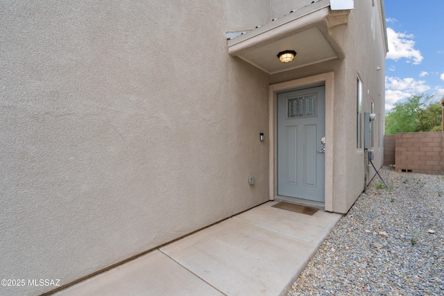 156 E Stone Ct, Tucson, AZ 85705 - entrance to property with stucco siding and fence