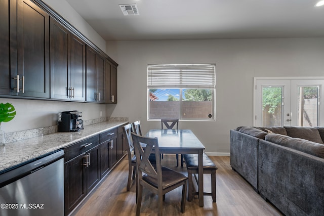 156 E Stone Ct, Tucson, AZ 85705 - dining room featuring wood finished floors and baseboards