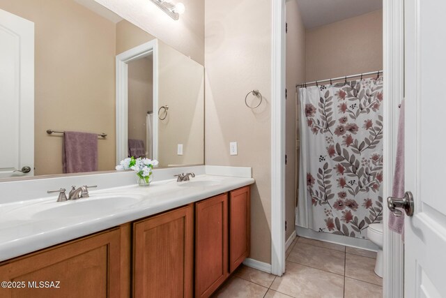 1933 E Lafayette Ave, Gilbert, AZ 85298 - bathroom featuring double vanity, tile patterned floors, toilet, and a sink