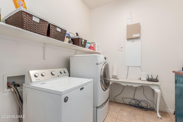1933 E Lafayette Ave, Gilbert, AZ 85298 - laundry room featuring washer and clothes dryer, laundry area, light tile patterned flooring, and baseboards