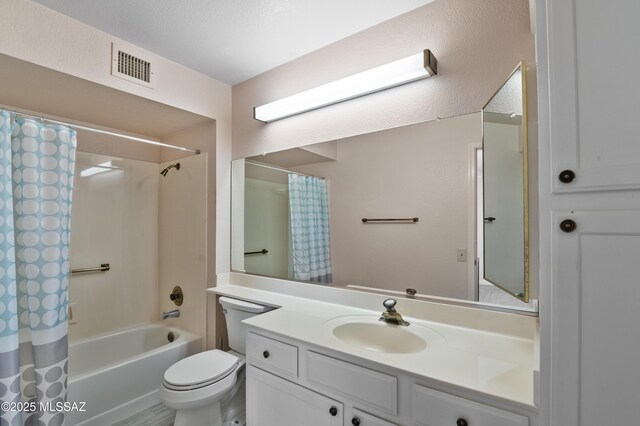 full bathroom featuring vanity, toilet, visible vents, and shower / bath combination with curtain