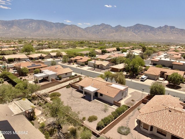 drone / aerial view featuring a residential view and a mountain view