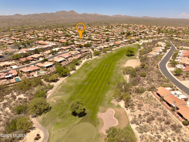 bird's eye view featuring view of golf course, a mountain view, and a residential view