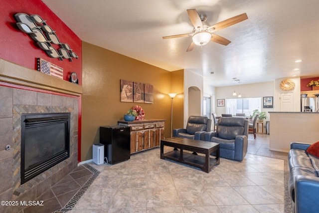12445 N Crimson Vista Dr, Marana, AZ 85658 - living room featuring ceiling fan and a fireplace