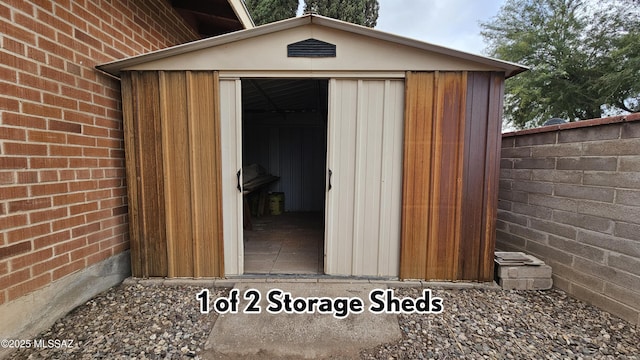 view of shed with fence