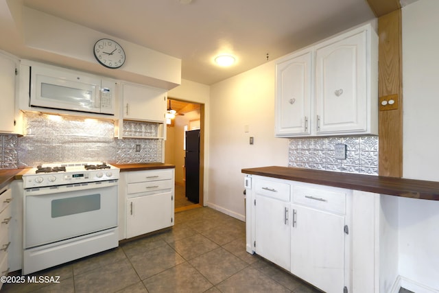 kitchen with white cabinetry, butcher block counters, white appliances, and tasteful backsplash